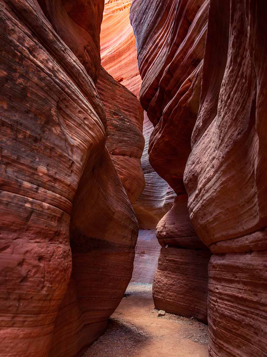 Sandstone walls in Red Canyon Slot Aka Peekaboo. Utah